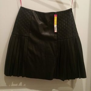 Pleated mini A line skirt Roman style faux leather